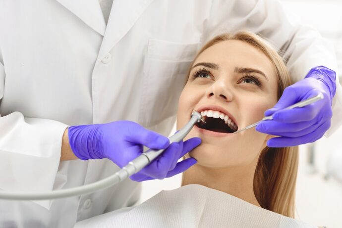 woman getting dental work done at a dental office