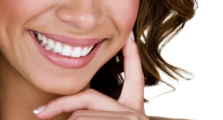 woman smiling with white teeth from teeth whitening treatment