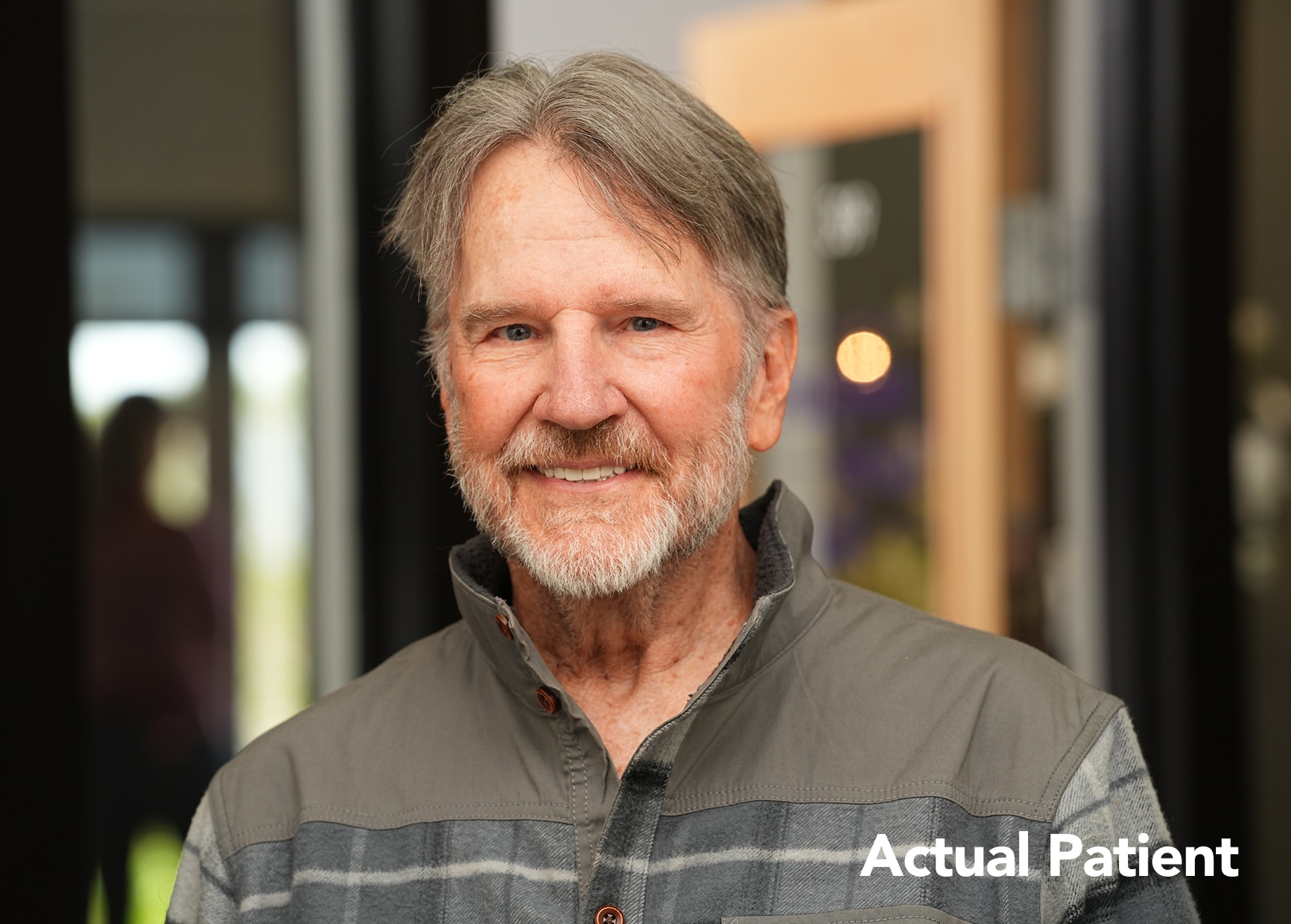 Headshot of Dallas smiling after completing his dental implant treatment at Longmont Dental Loft.
