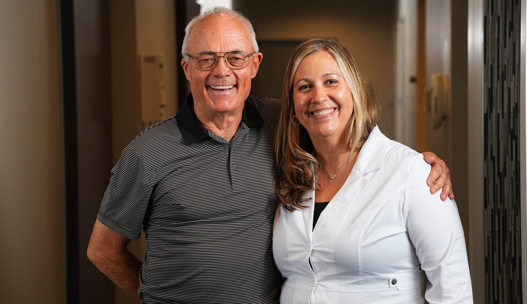 Dr. Hedrick with a patient that had dental implants placed.