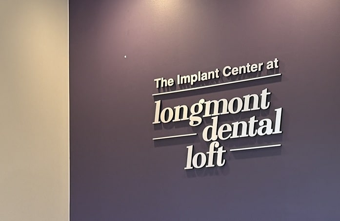 Interior wall signage for The Implant Center at Longmont Dental Loft in Longmont, Colorado.