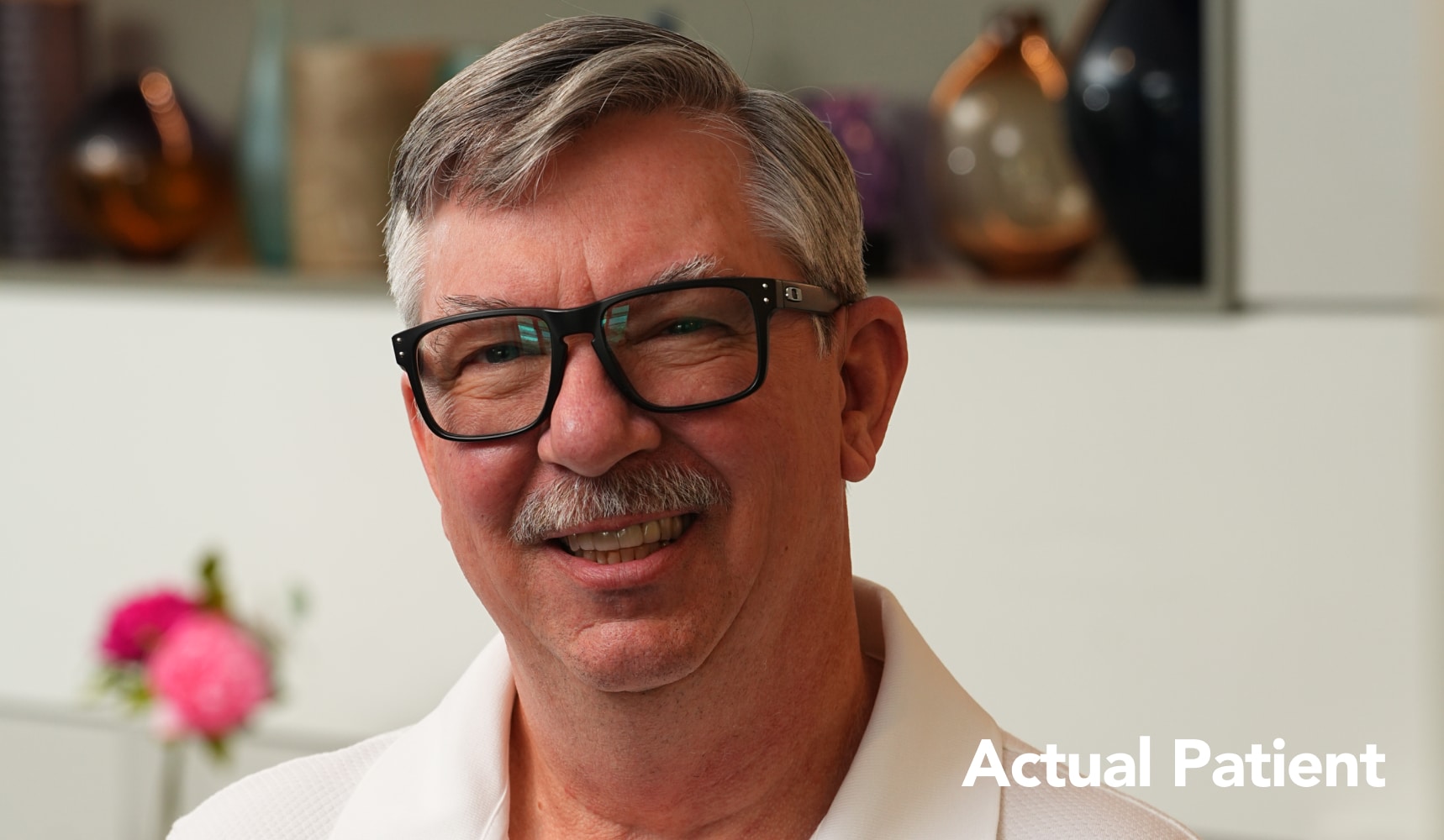 Mark smiling in an after photo following his dental crown treatment at Longmont Dental Loft.