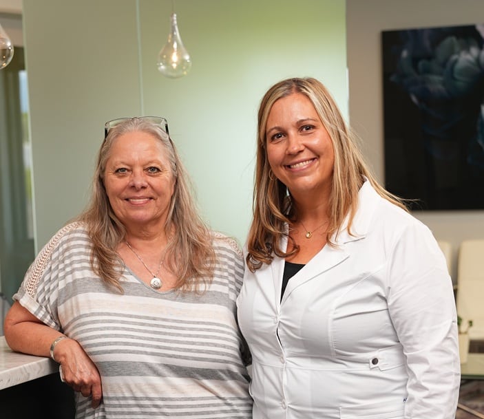 Dr. Hedrick with an oral surgery patient in the reception area at Longmont Dental Loft.
