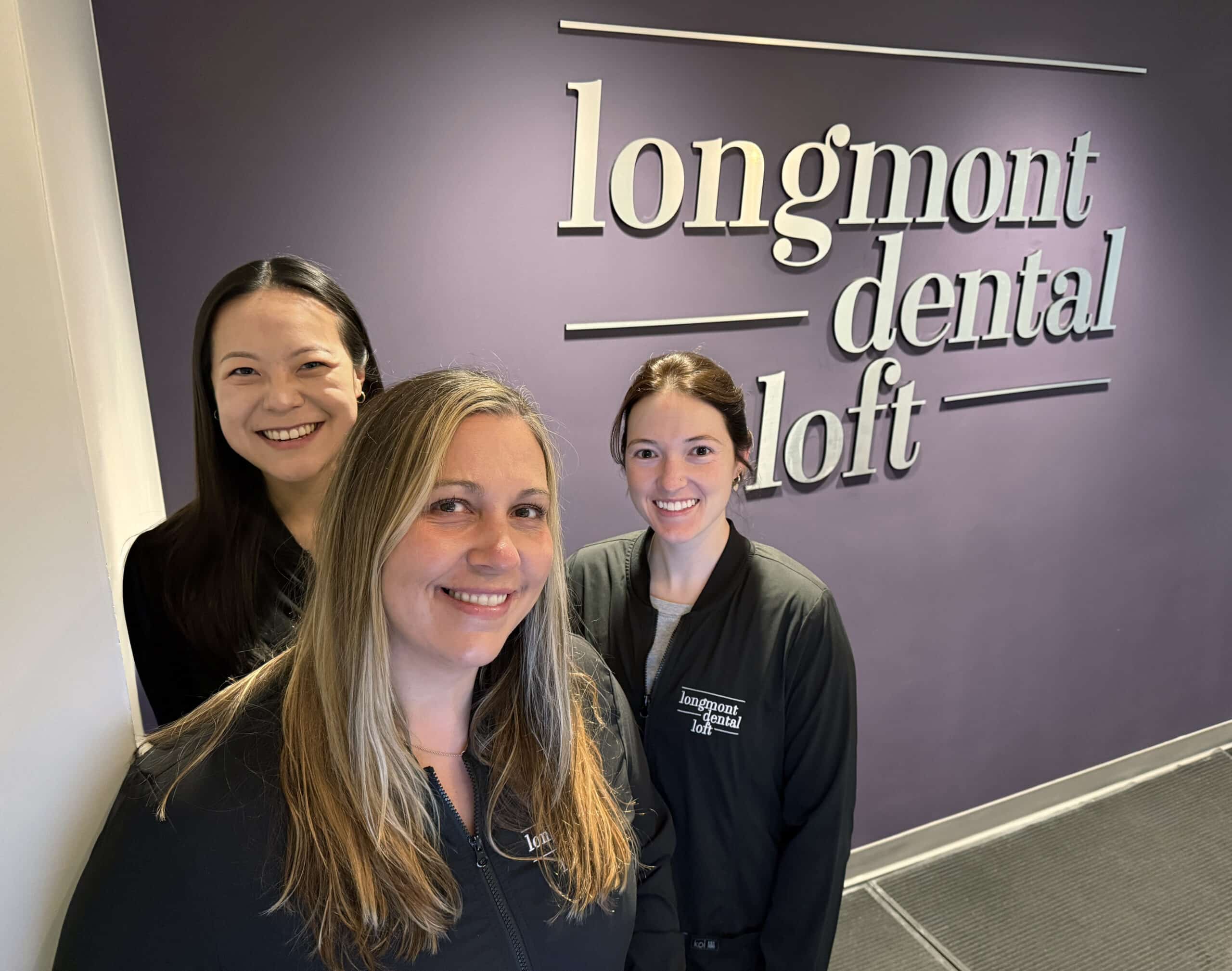 Doctors at the front desk of Longmont Dental Loft in Longmont, Colorado