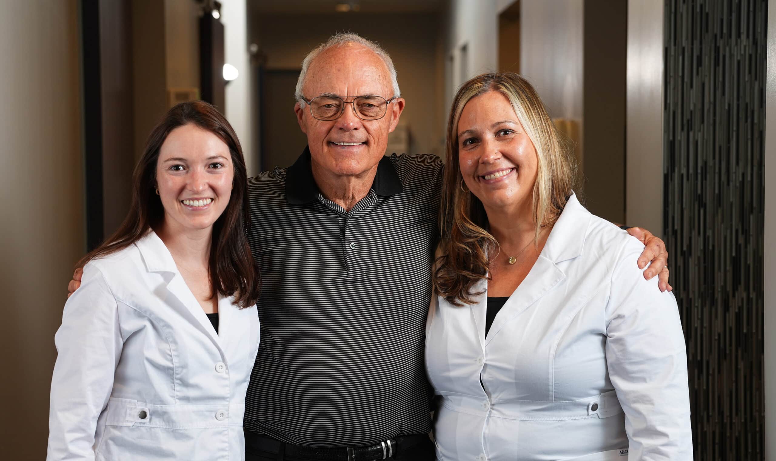 Dr. Megan Ryan and Dr. Adrienne Hedrick with implant patient Duane
