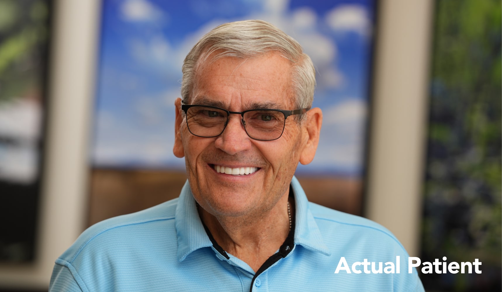 Lon smiling and pleased with the results of his full-arch dental implants at Longmont Dental Loft